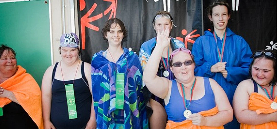 Athletes posing post swim meet