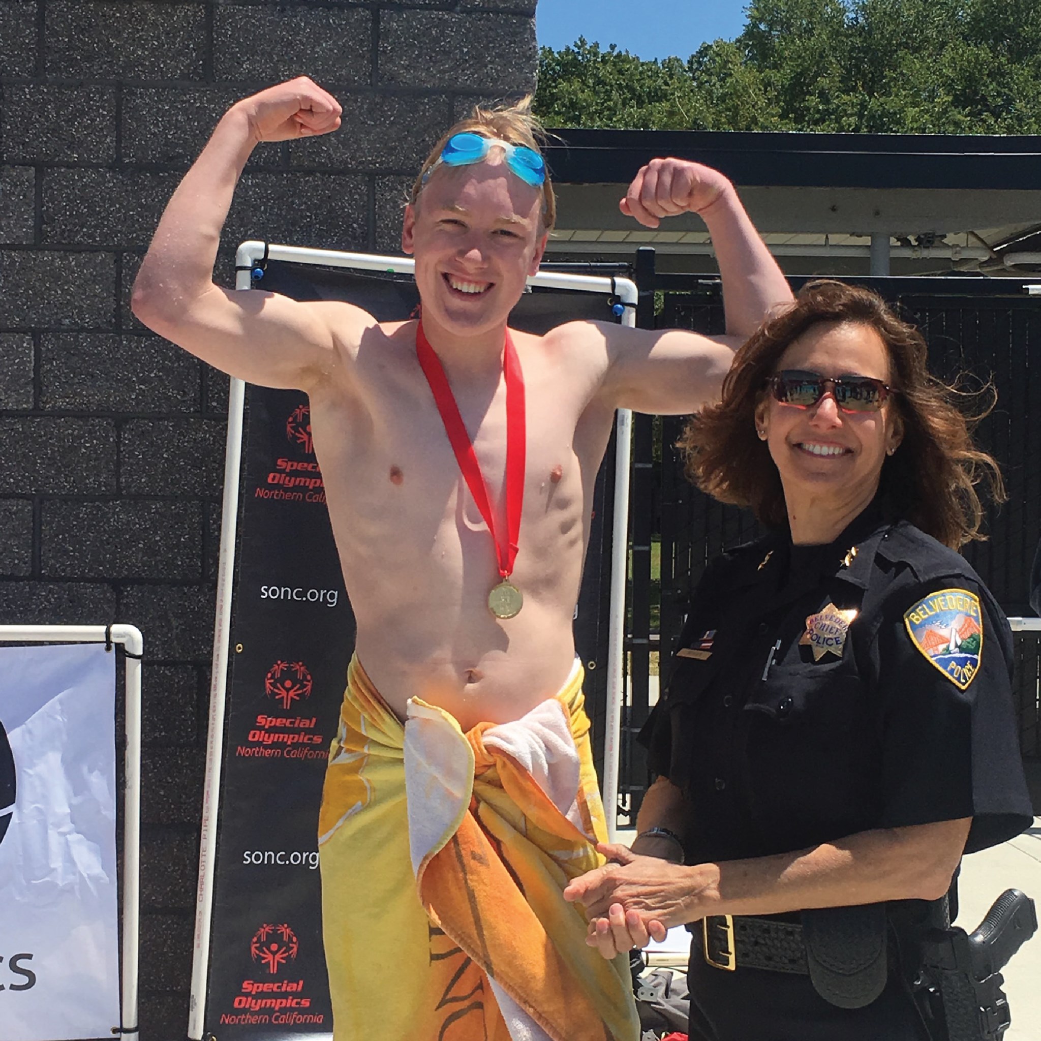 Wyatt Wheetley flexes with an award