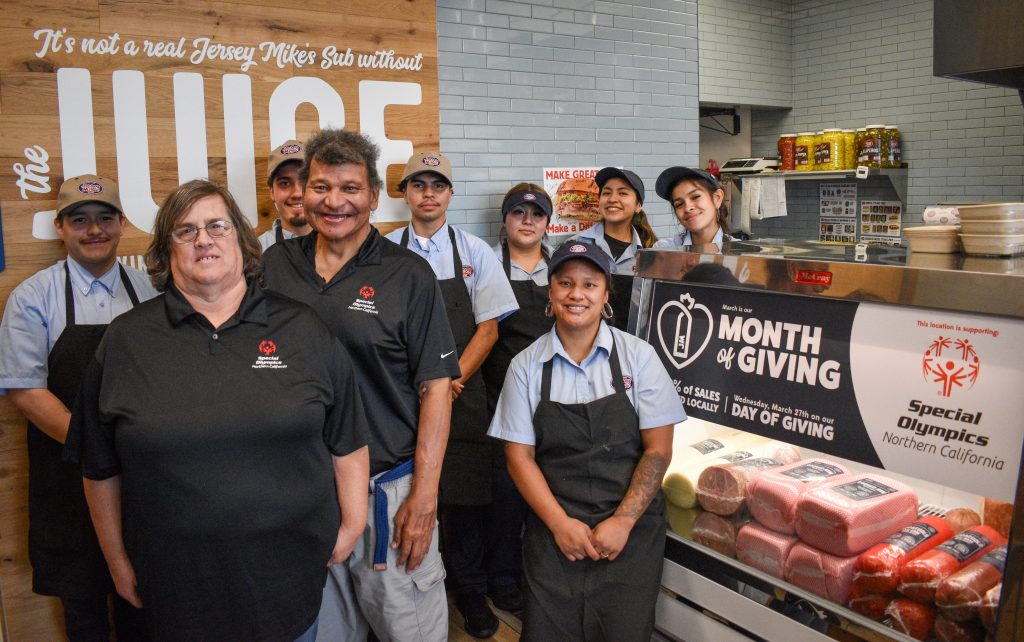 Jersey Mikes - Athletes and employees in the store