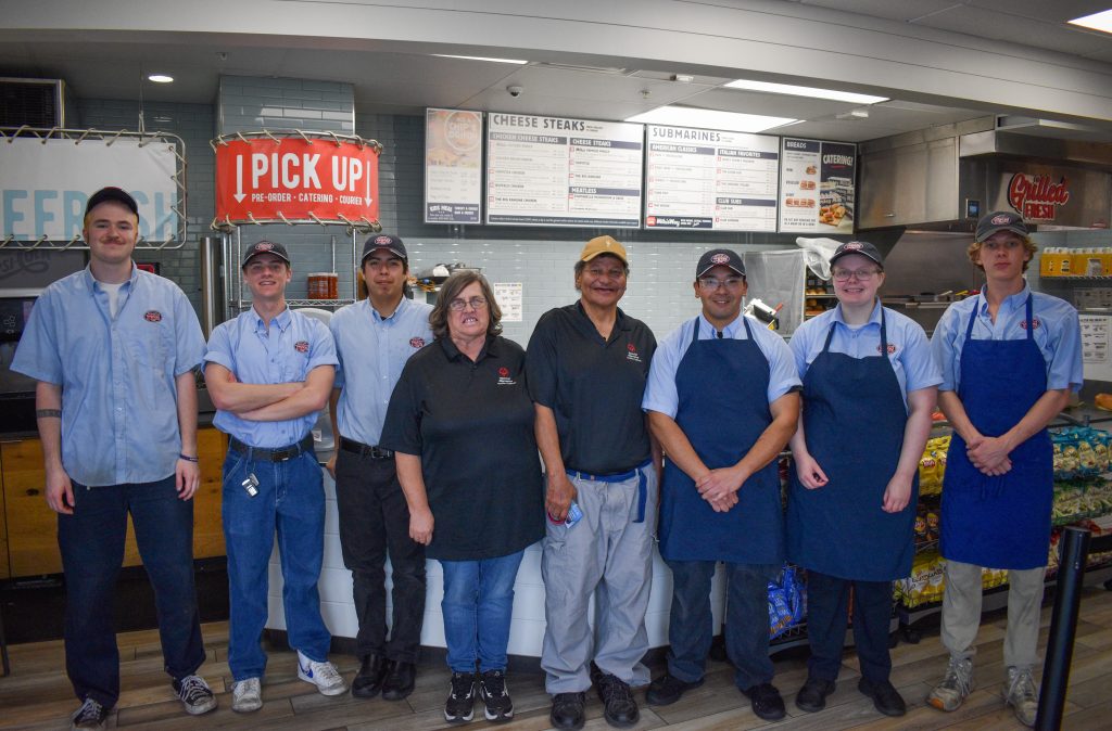 Jersey Mikes - Athletes and employees in the store