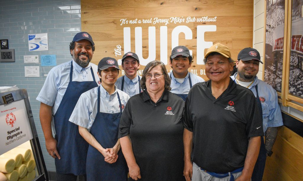 Jersey Mikes - Athletes and employees in the store