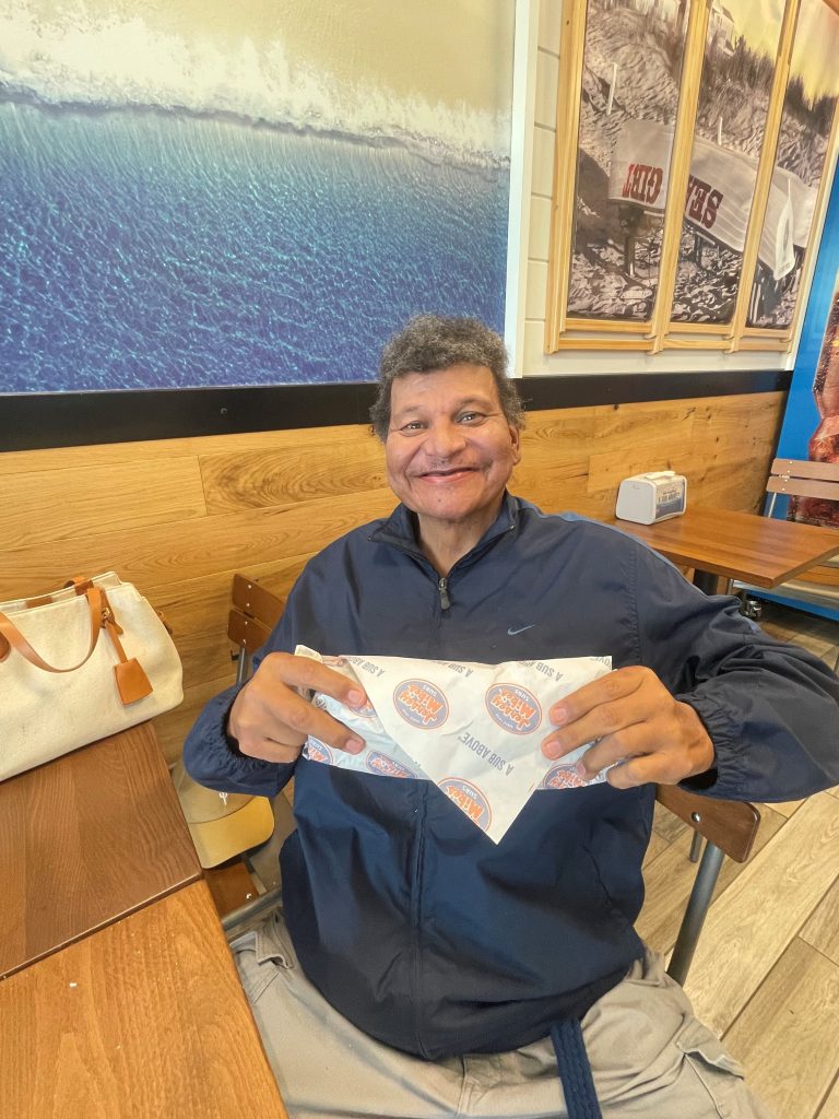 Jersey Mikes - Person holding sandwich