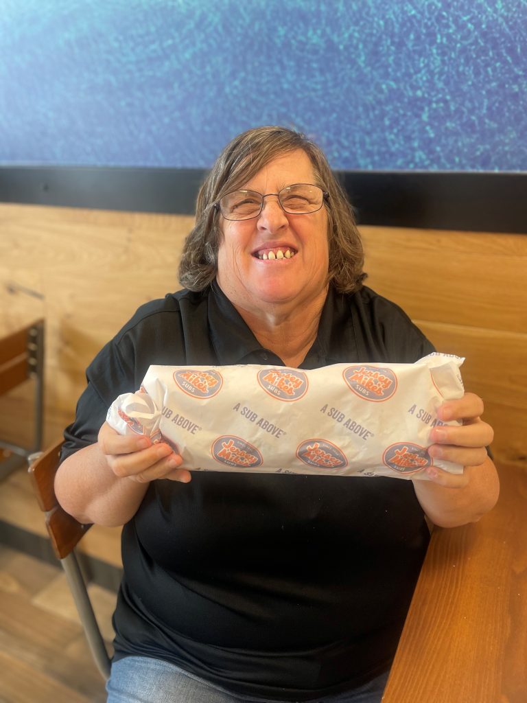 Jersey Mikes - Person holding sandwich