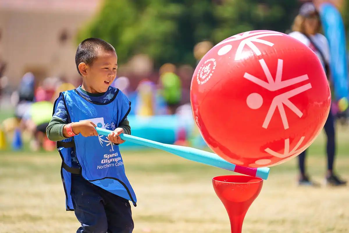 Young Athletes Fair - Boy Playing with Red  Balloon
